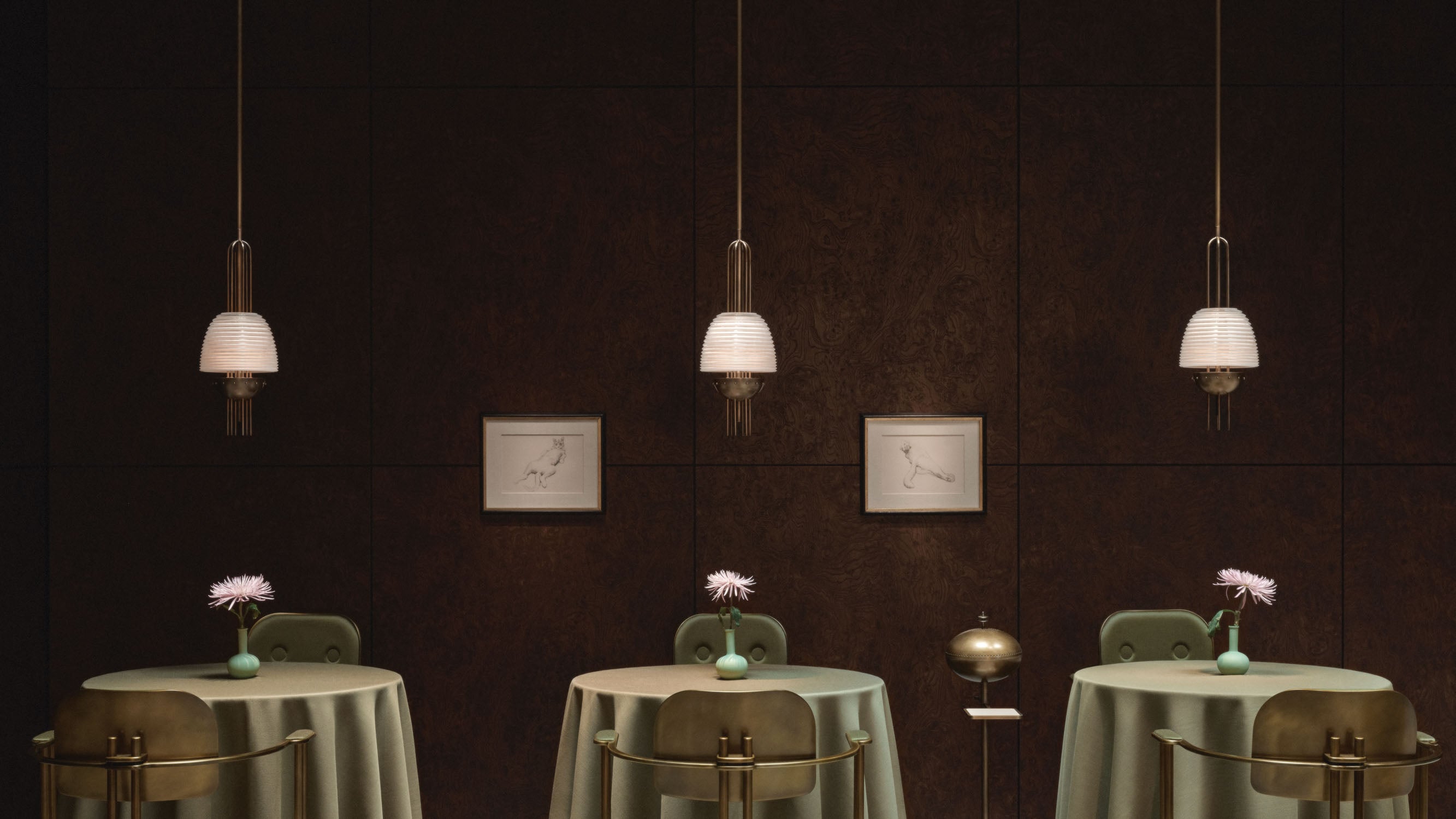 Minimalist interior with three round tables covered in green cloth, each with a single flower in a vase, pendant lights, and framed art.