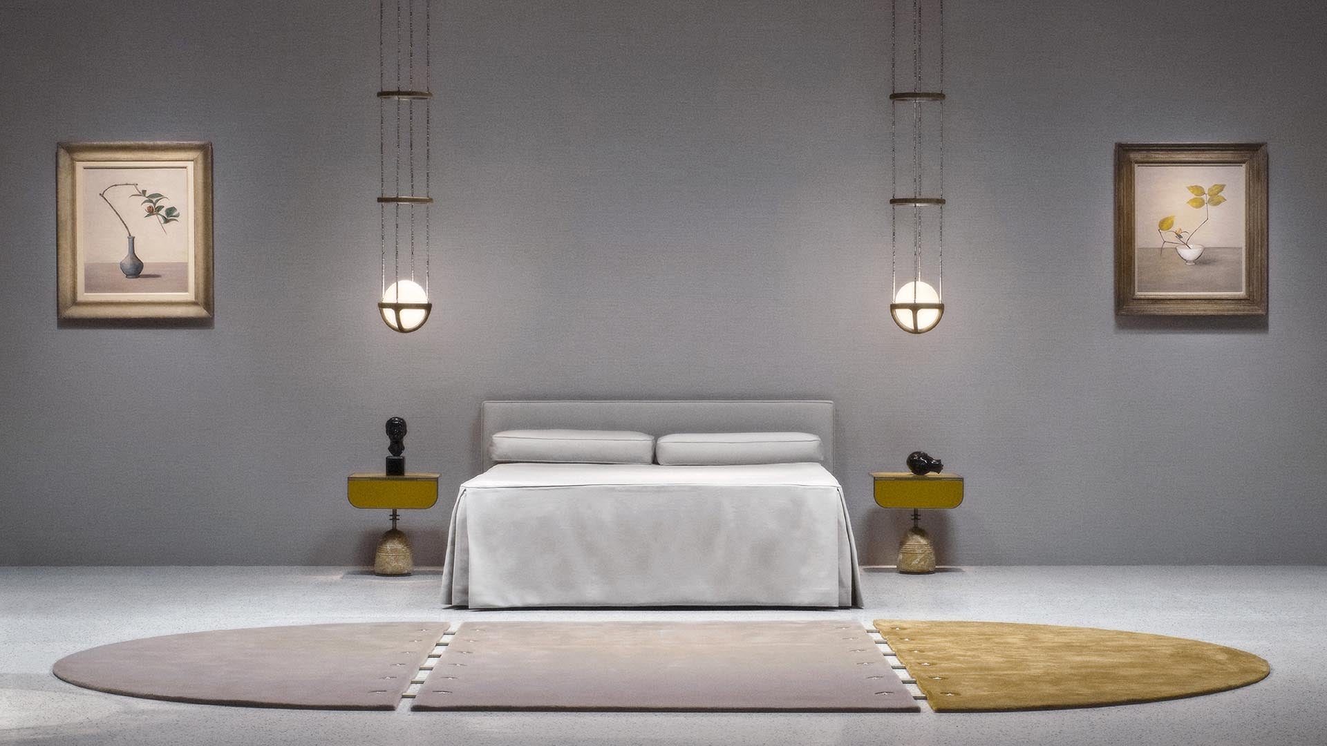 Minimalist bedroom with a gray upholstered bed, matching nightstands, pendant lights, framed botanical prints, and a three-tone rug.