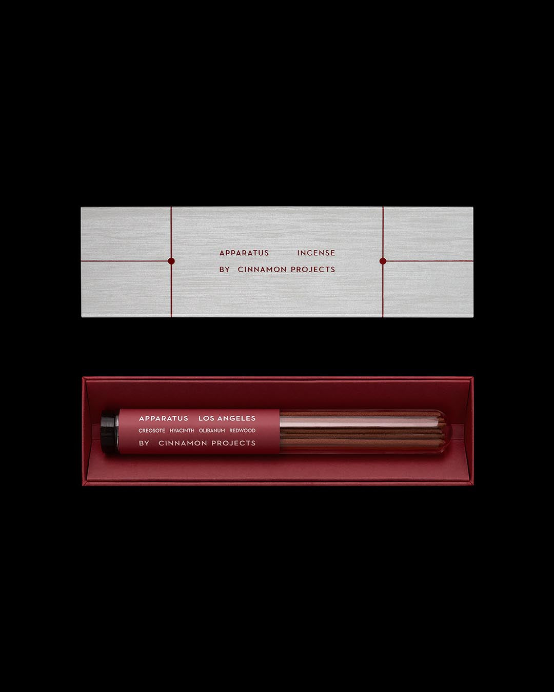 Top view of a sleek red and gray boxed incense set labeled Apparatus Los Angeles by Cinnamon Projects on a black background