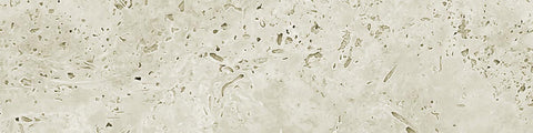 Close-up of beige travertine stone surface with natural pits and irregular texture against a neutral background