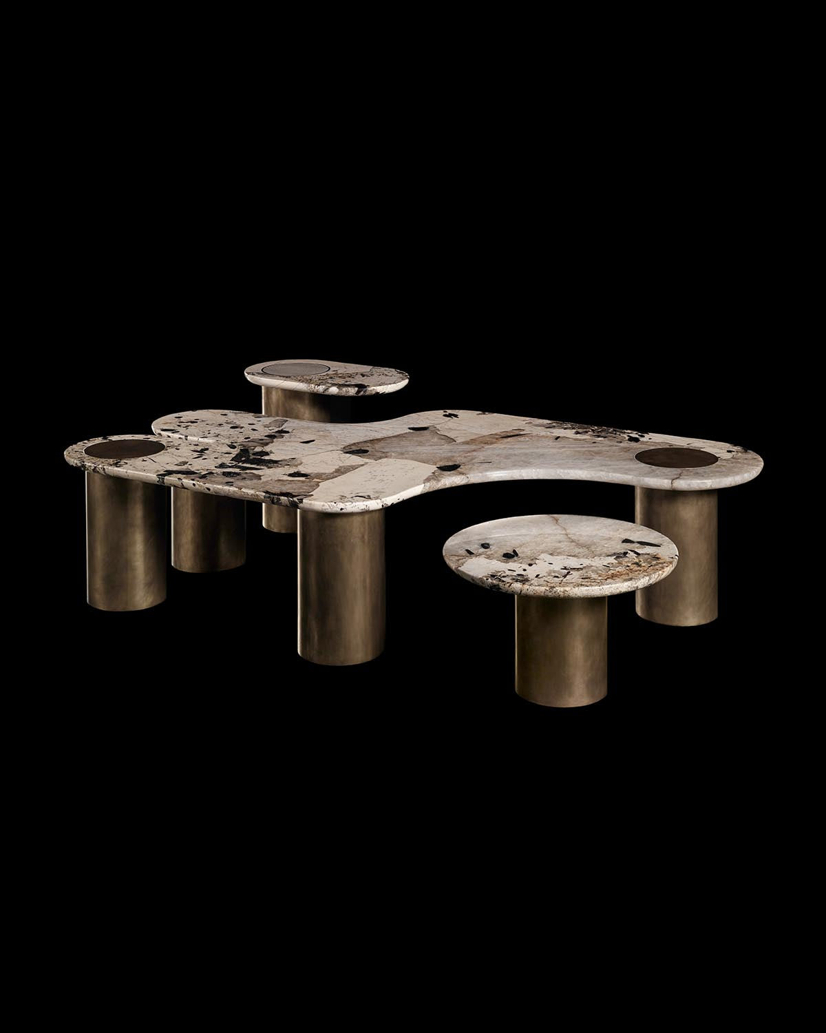 Modern sculptural marble table with organic curved top and cylindrical bronze legs against a black background